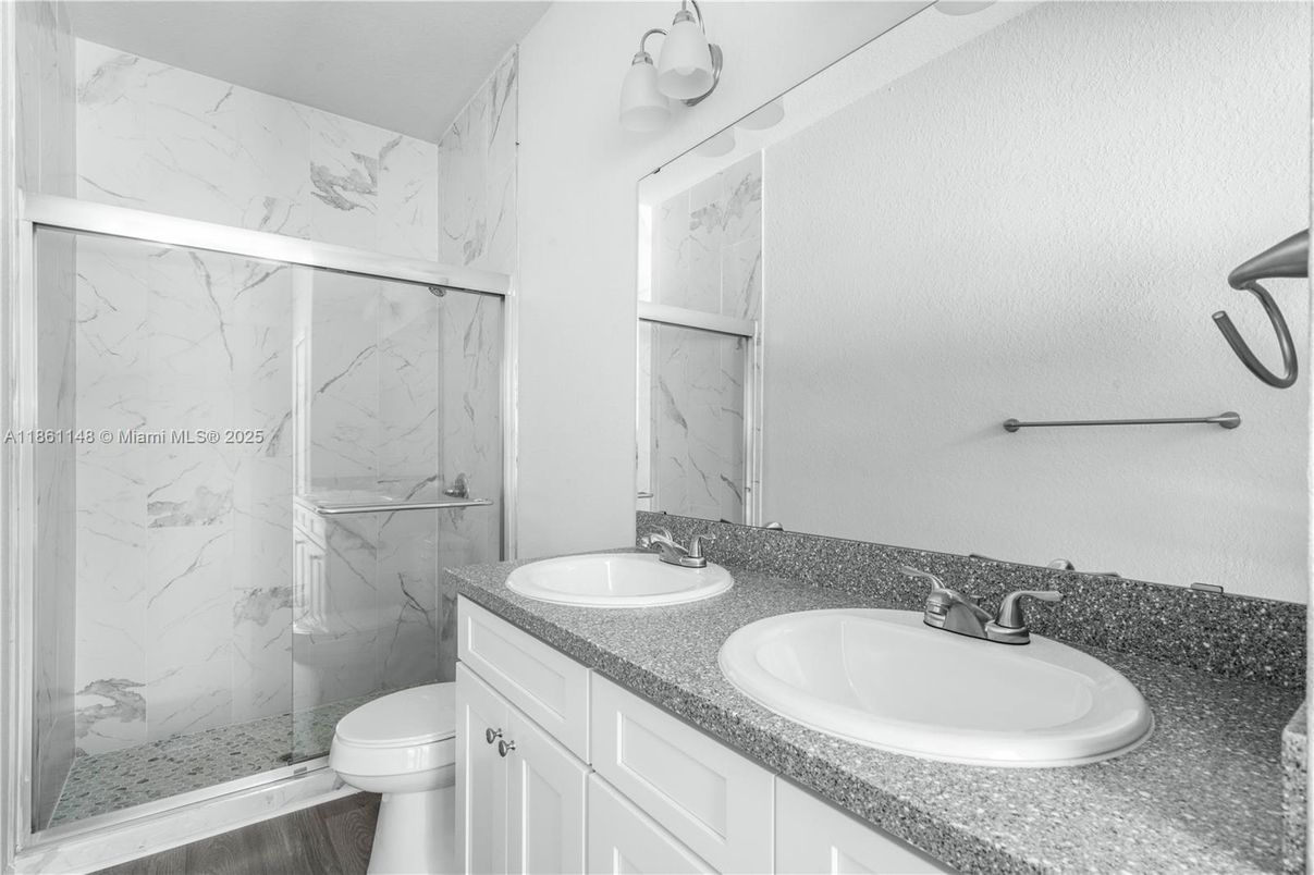 Bathroom, Dual Sink Vanities, Glass Shower, Interior, Marble Walls, Wood Texture Flooring