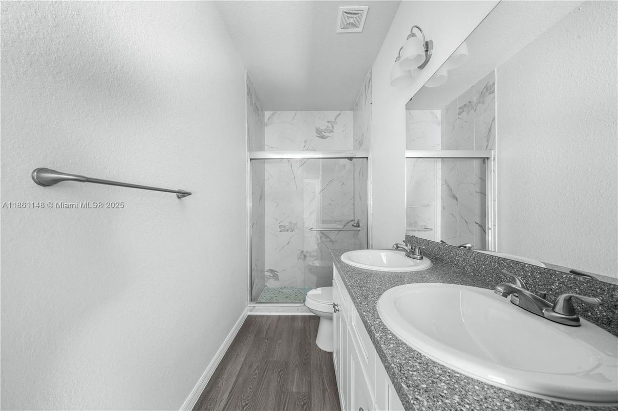 Bathroom, Dual Sink Vanities, Glass Shower, Interior, Marble Walls, Wood Texture Flooring