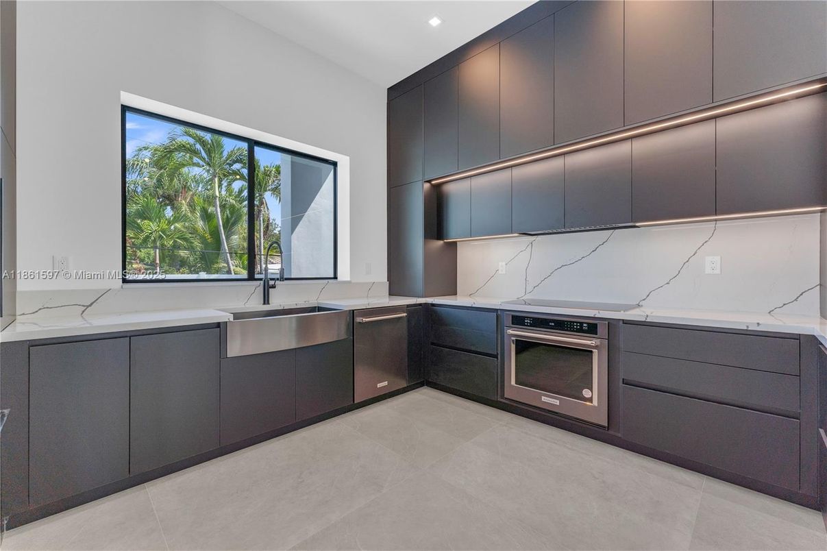 Interior, Kitchen, Marble Walls, Recessed Lighting, Stainless Steel Appliances