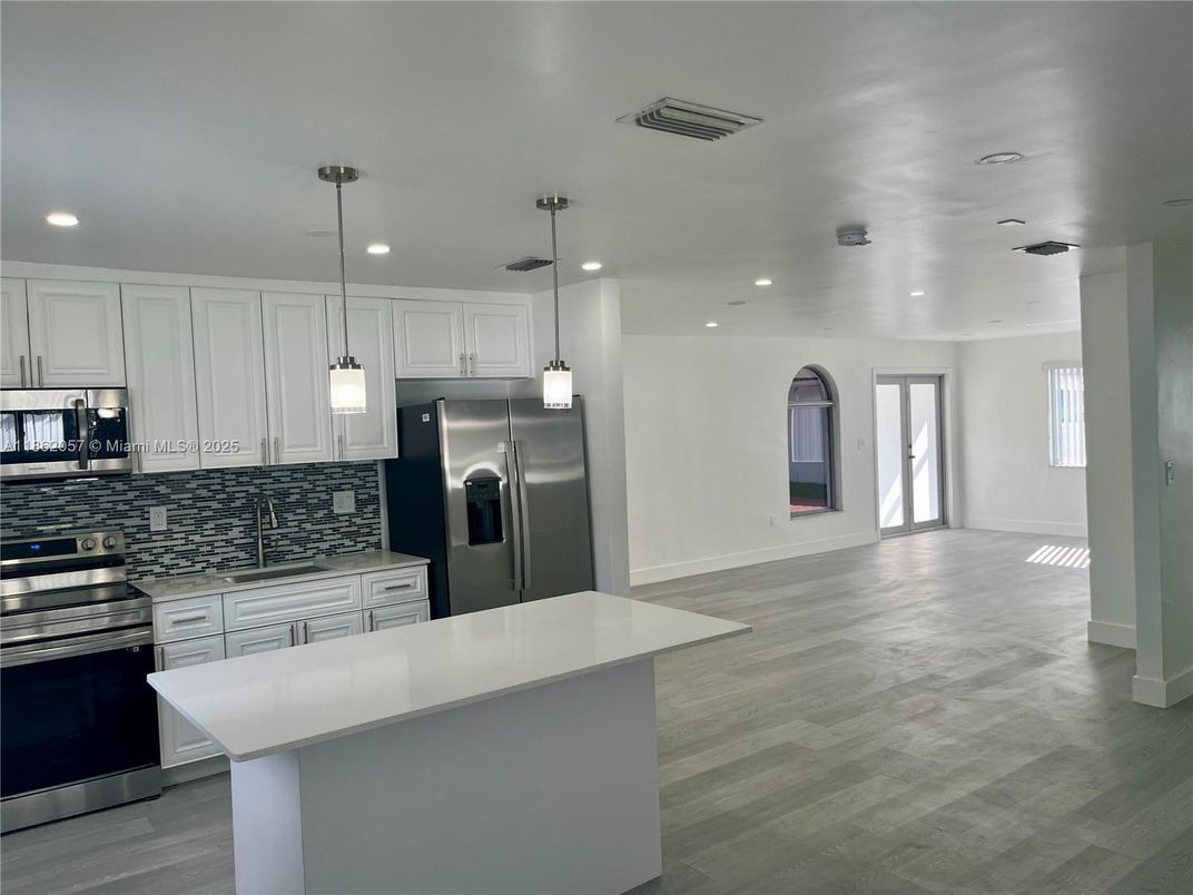 Interior, Kitchen, Pendant Lights, Recessed Lighting, Stainless Steel Appliances, Wood Texture Flooring