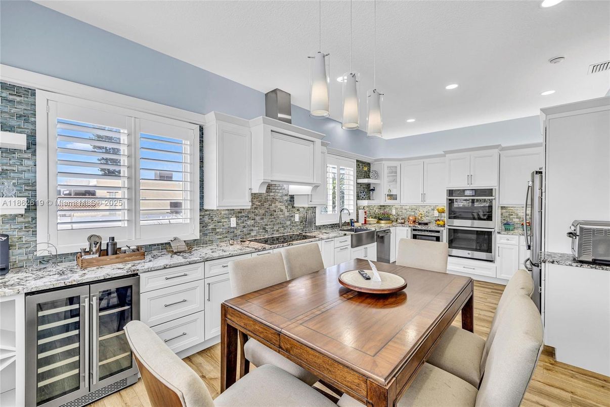 Dining room, Interior, Kitchen, Pendant Lights, Recessed Lighting, Stainless Steel Appliances, Wood Texture Flooring