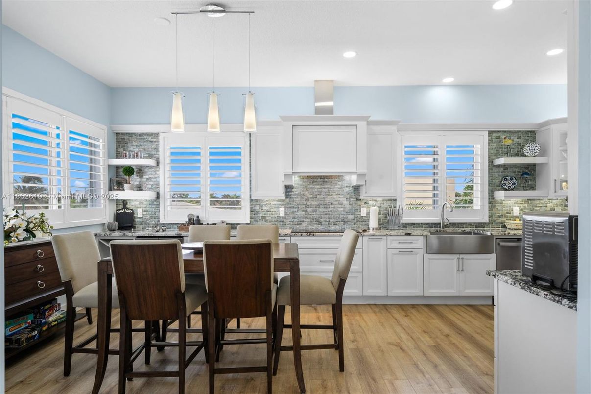 Dining room, Interior, Kitchen, Pendant Lights, Recessed Lighting, Stainless Steel Appliances, Water, Wood Texture Flooring