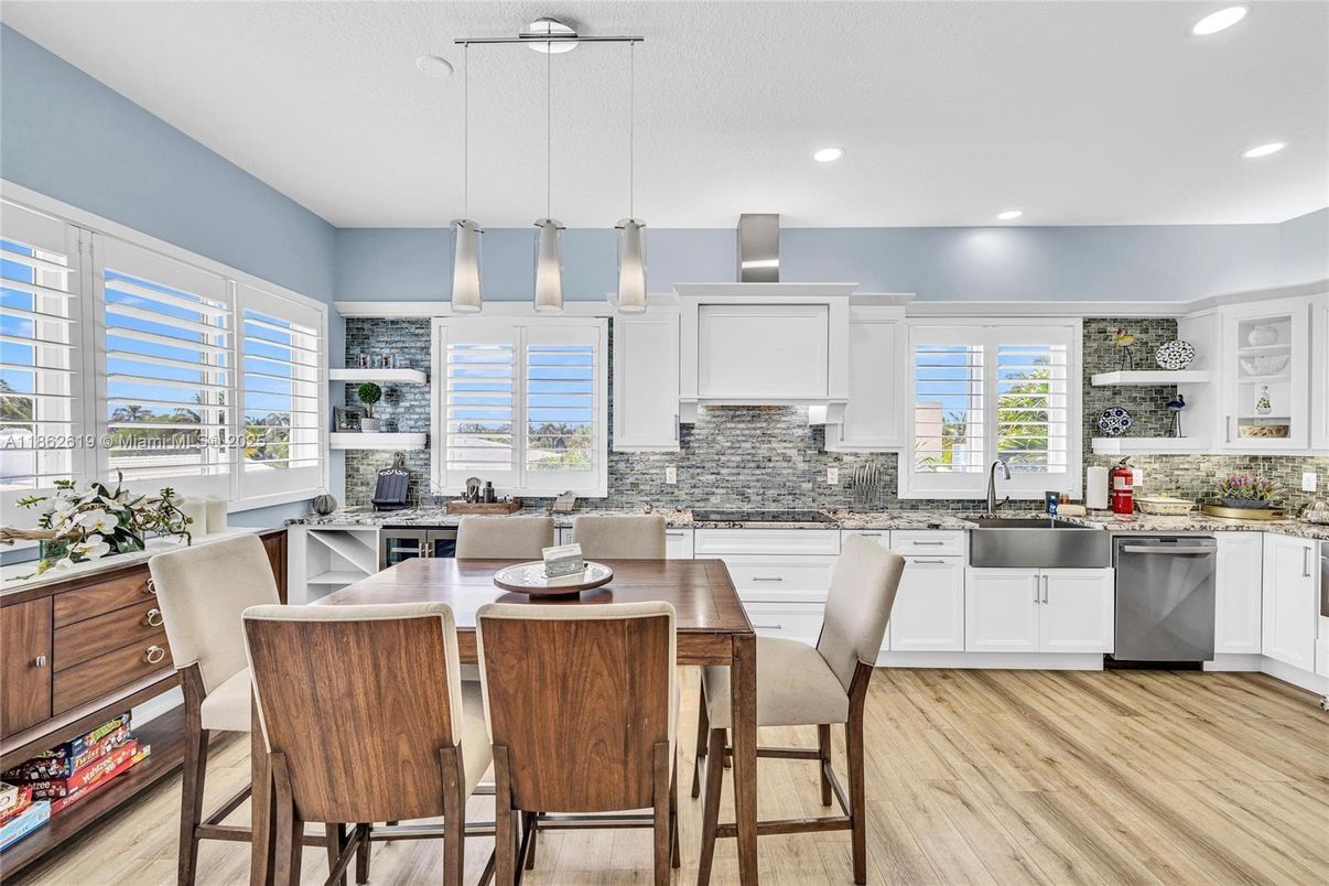 Dining room, Interior, Kitchen, Pendant Lights, Recessed Lighting, Stainless Steel Appliances, Wood Texture Flooring
