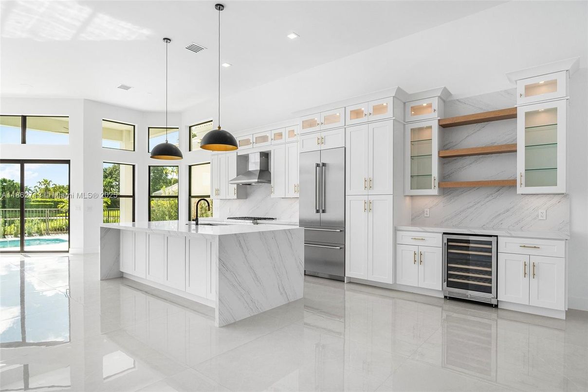 Interior, Kitchen, Marble Walls, Pendant Lights, Recessed Lighting, Stainless Steel Appliances