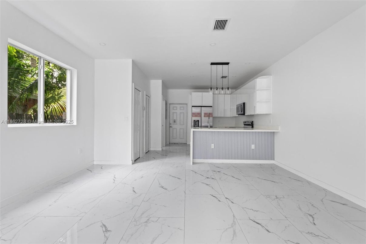 Empty room, Interior, Kitchen, Marble, Pendant Lights, Recessed Lighting, Stainless Steel Appliances