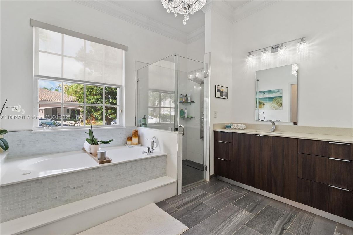 Bathroom, Chandelier, Dual Sink Vanities, Glass Shower, Interior, Wood Texture Flooring