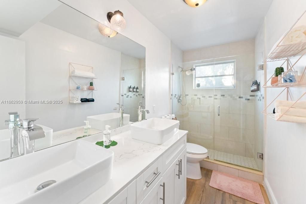 Bathroom, Dual Sink Vanities, Glass Shower, Interior, Wood Texture Flooring