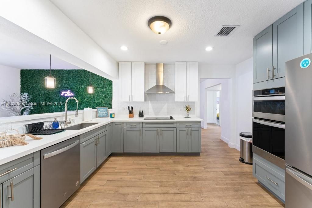 Interior, Kitchen, Pendant Lights, Recessed Lighting, Stainless Steel Appliances, Wood Texture Flooring