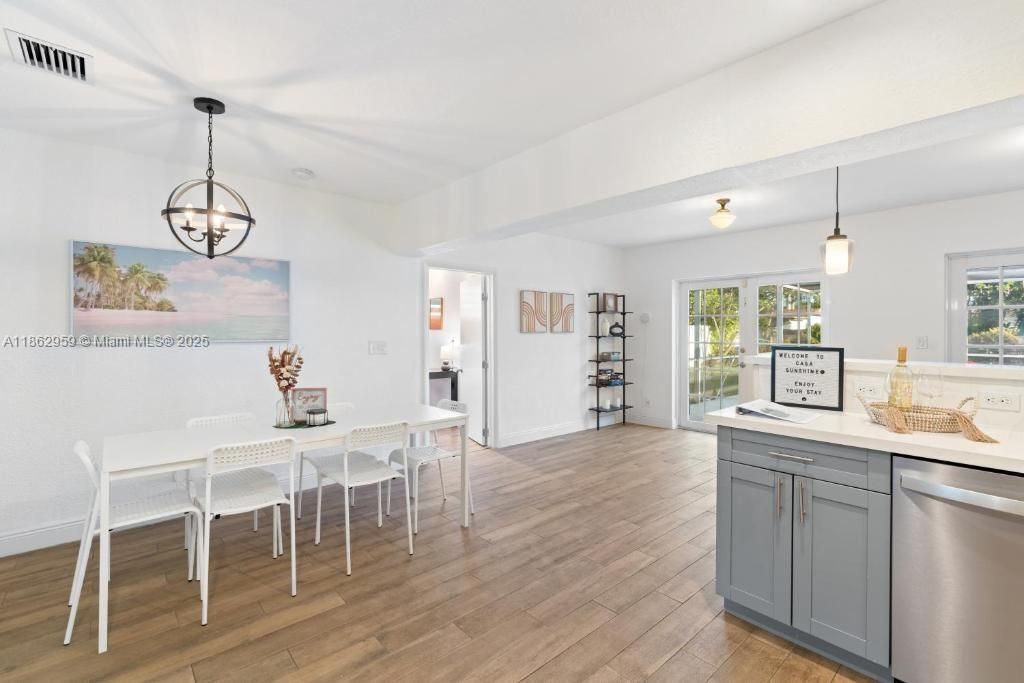 Dining room, Interior, Kitchen, Pendant Lights, Stainless Steel Appliances, Wood Texture Flooring