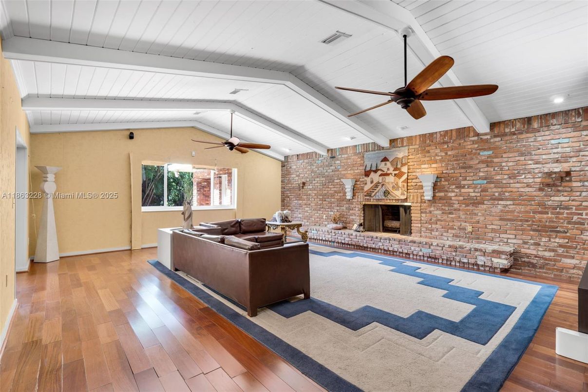 Fireplace, Interior, Living room, Recessed Lighting, Stone Walls, Wood Texture Flooring