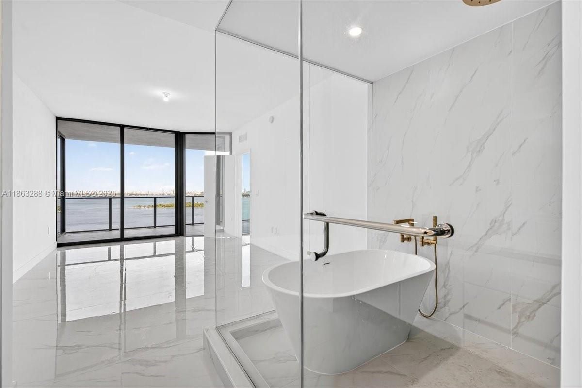 Bathroom, Free Standing Baths, Interior, Marble, Marble Walls, Recessed Lighting, Water