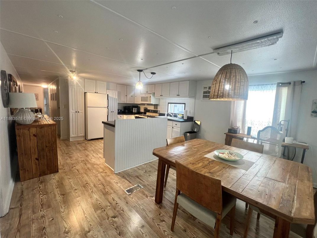 Dining room, Interior, Kitchen, Pendant Lights, Stainless Steel Appliances, Wood Texture Flooring