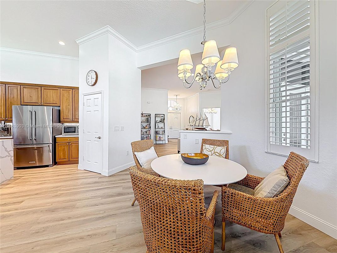 Chandelier, Dining room, Interior, Kitchen, Recessed Lighting, Stainless Steel Appliances, Wood Texture Flooring