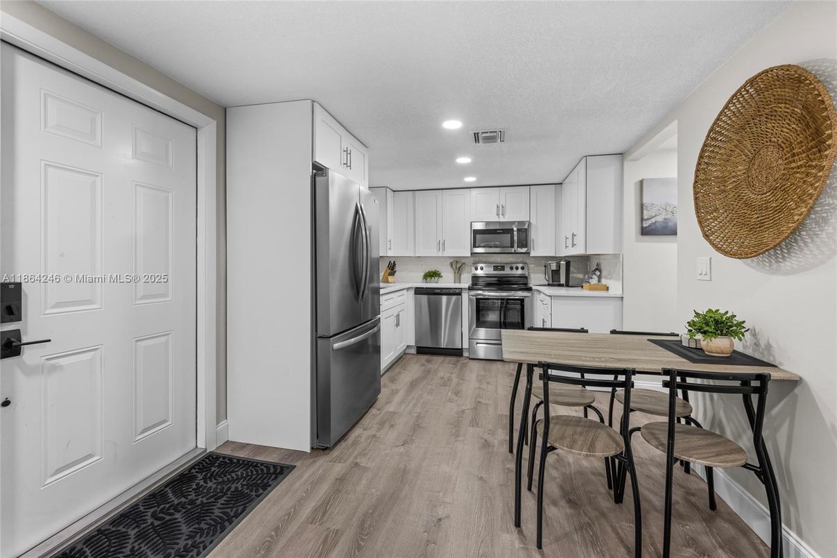 Dining room, Interior, Kitchen, Recessed Lighting, Stainless Steel Appliances, Wood Texture Flooring