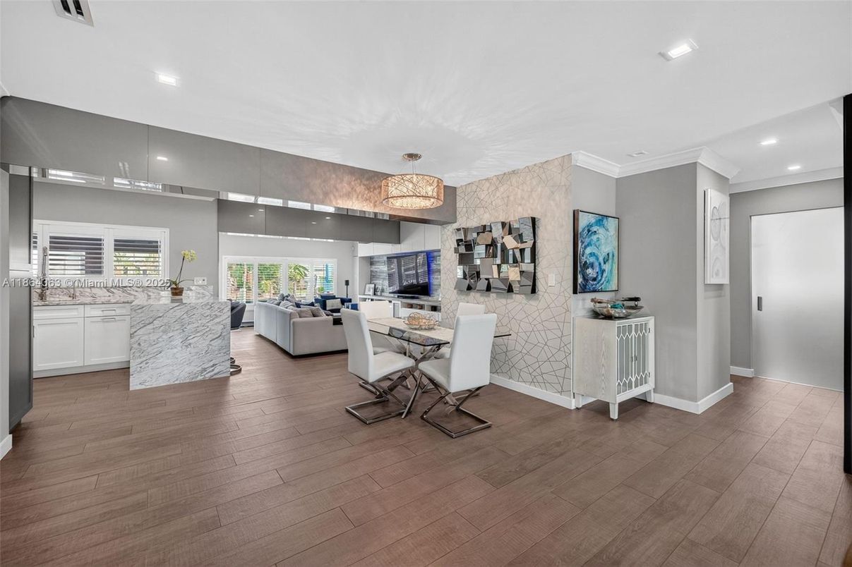 Chandelier, Dining room, Interior, Living room, Marble Walls, Recessed Lighting, Wood Texture Flooring