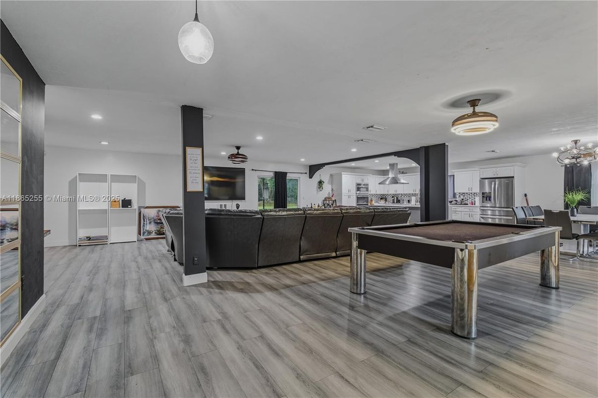 Billiard Table, Dining room, Game Room, Interior, Living room, Pendant Lights, Recessed Lighting, Wood Texture Flooring