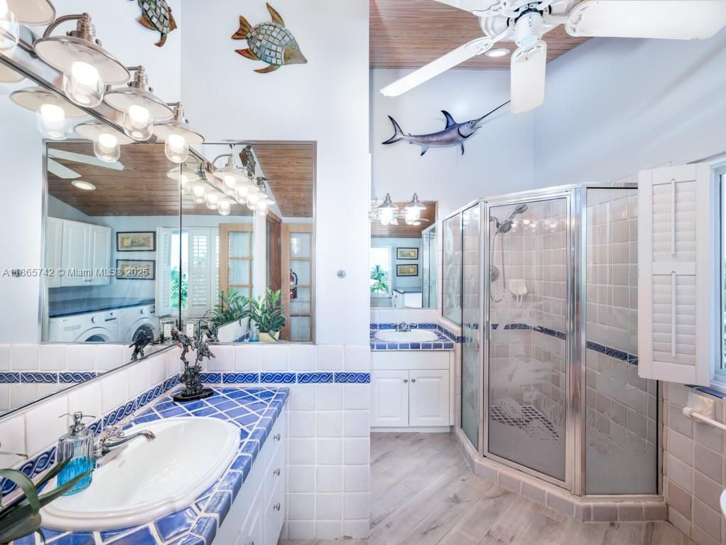 Bathroom, Dual Sink Vanities, Glass Shower, Interior, Tile Countertops, Wood Texture Flooring