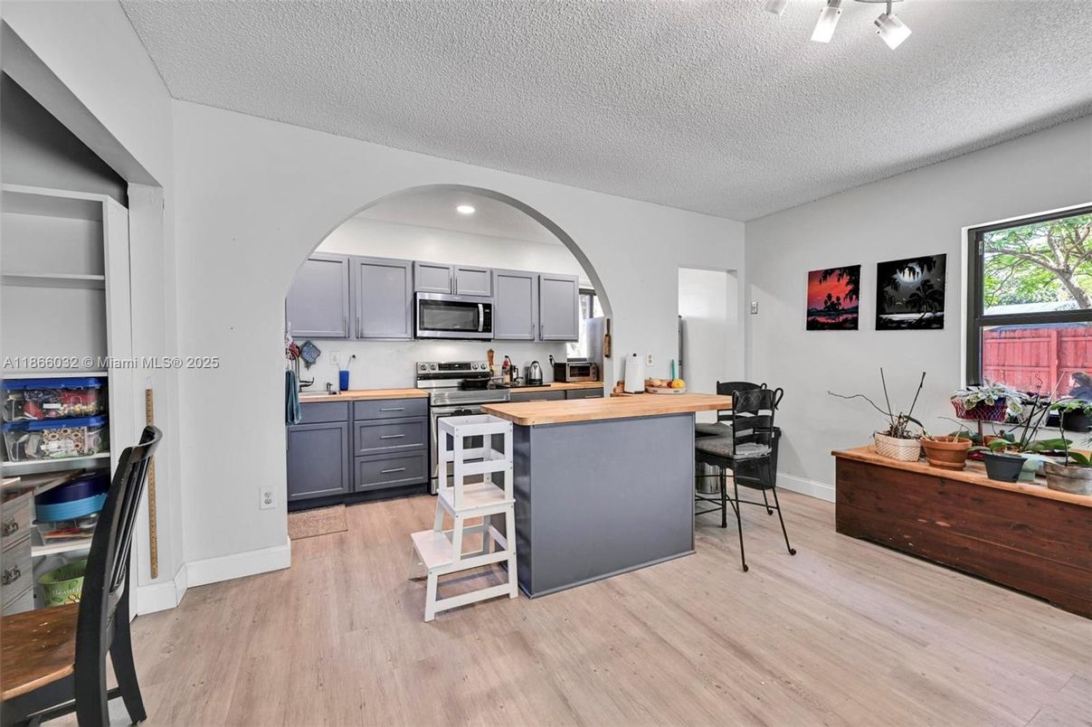 Dining room, Interior, Kitchen, Recessed Lighting, Stainless Steel Appliances, Wood Texture Flooring