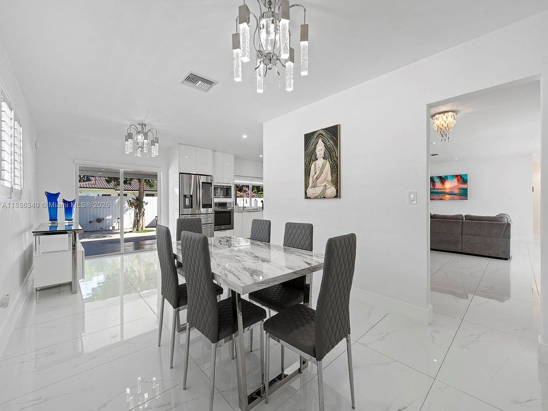 Chandelier, Dining room, Interior, Kitchen, Marble, Pendant Lights, Recessed Lighting, Stainless Steel Appliances