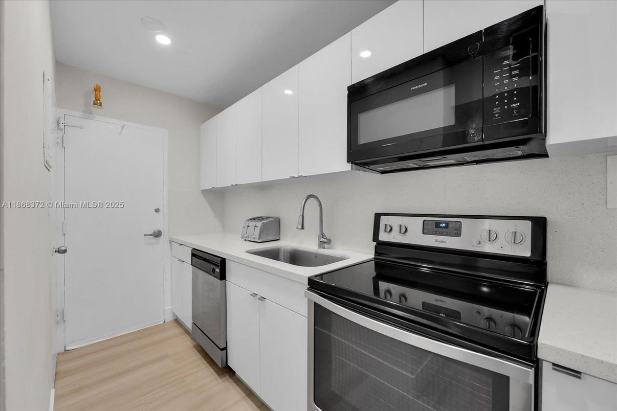 Interior, Kitchen, Recessed Lighting, Stainless Steel Appliances, Wood Texture Flooring