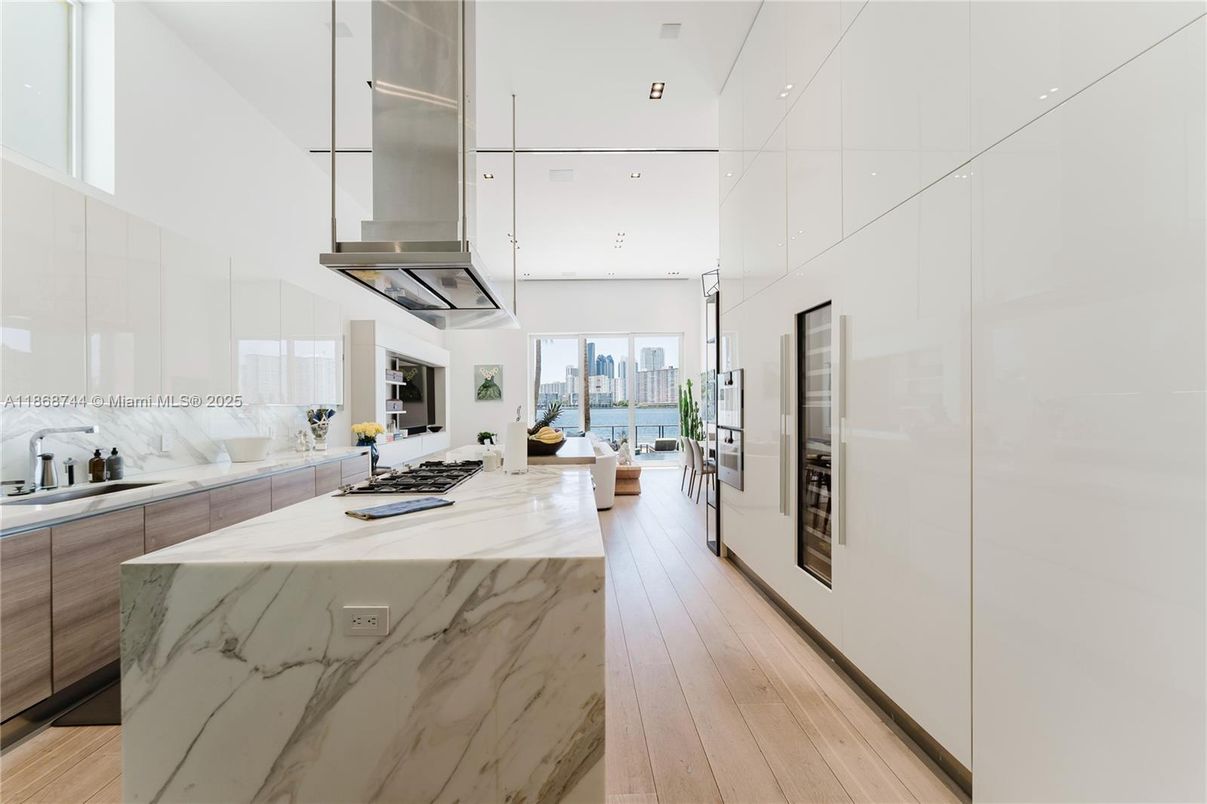Interior, Kitchen, Marble Walls, Pendant Lights, Recessed Lighting, Water, Wood Texture Flooring