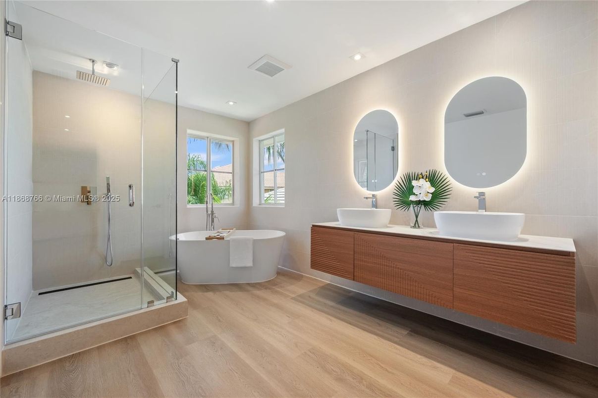 Bathroom, Dual Sink Vanities, Free Standing Baths, Glass Shower, Interior, Recessed Lighting, Wood Texture Flooring
