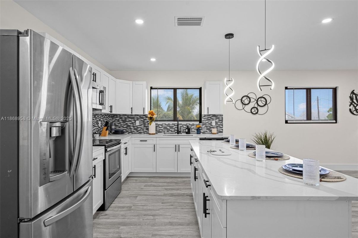 Interior, Kitchen, Pendant Lights, Recessed Lighting, Stainless Steel Appliances, Wood Texture Flooring