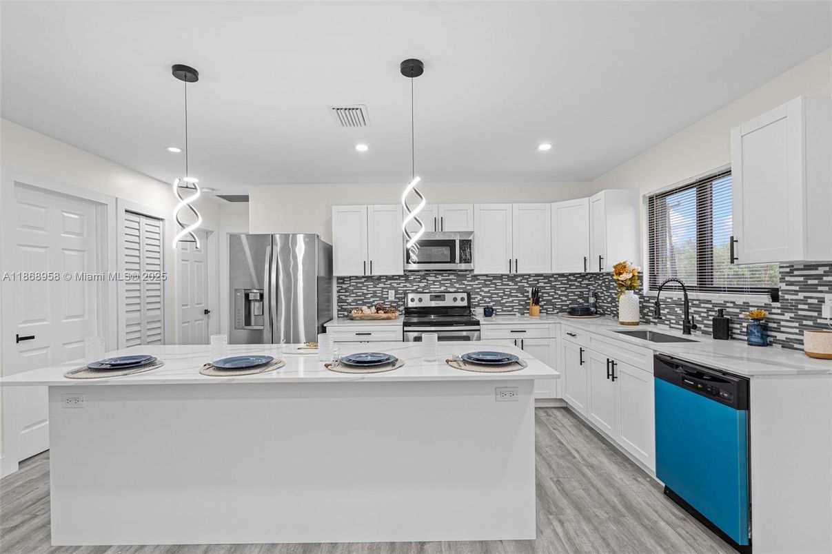 Interior, Kitchen, Pendant Lights, Recessed Lighting, Stainless Steel Appliances, Wood Texture Flooring