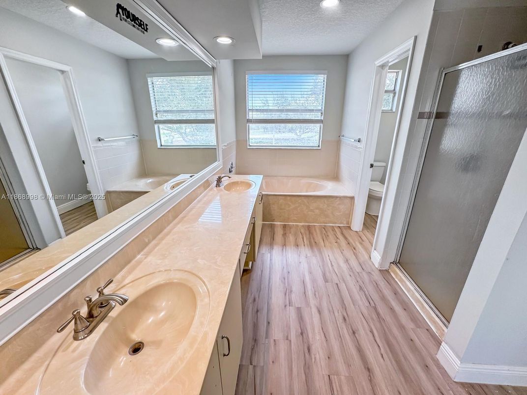 Bathroom, Dual Sink Vanities, Interior, Recessed Lighting, Wood Texture Flooring