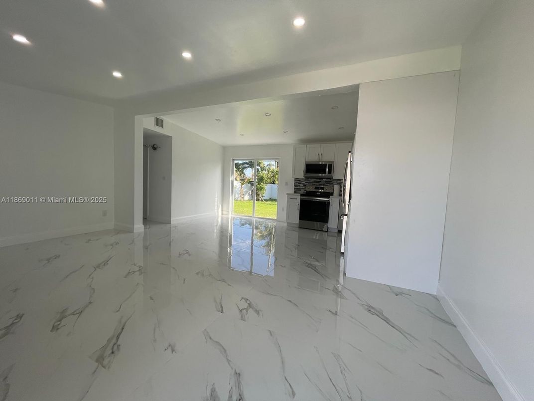 Empty room, Interior, Kitchen, Marble, Recessed Lighting, Stainless Steel Appliances