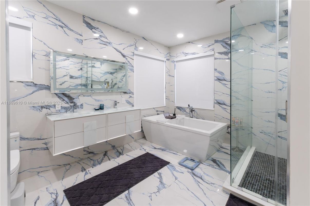 Bathroom, Dual Sink Vanities, Glass Shower, Interior, Marble, Marble Walls, Recessed Lighting
