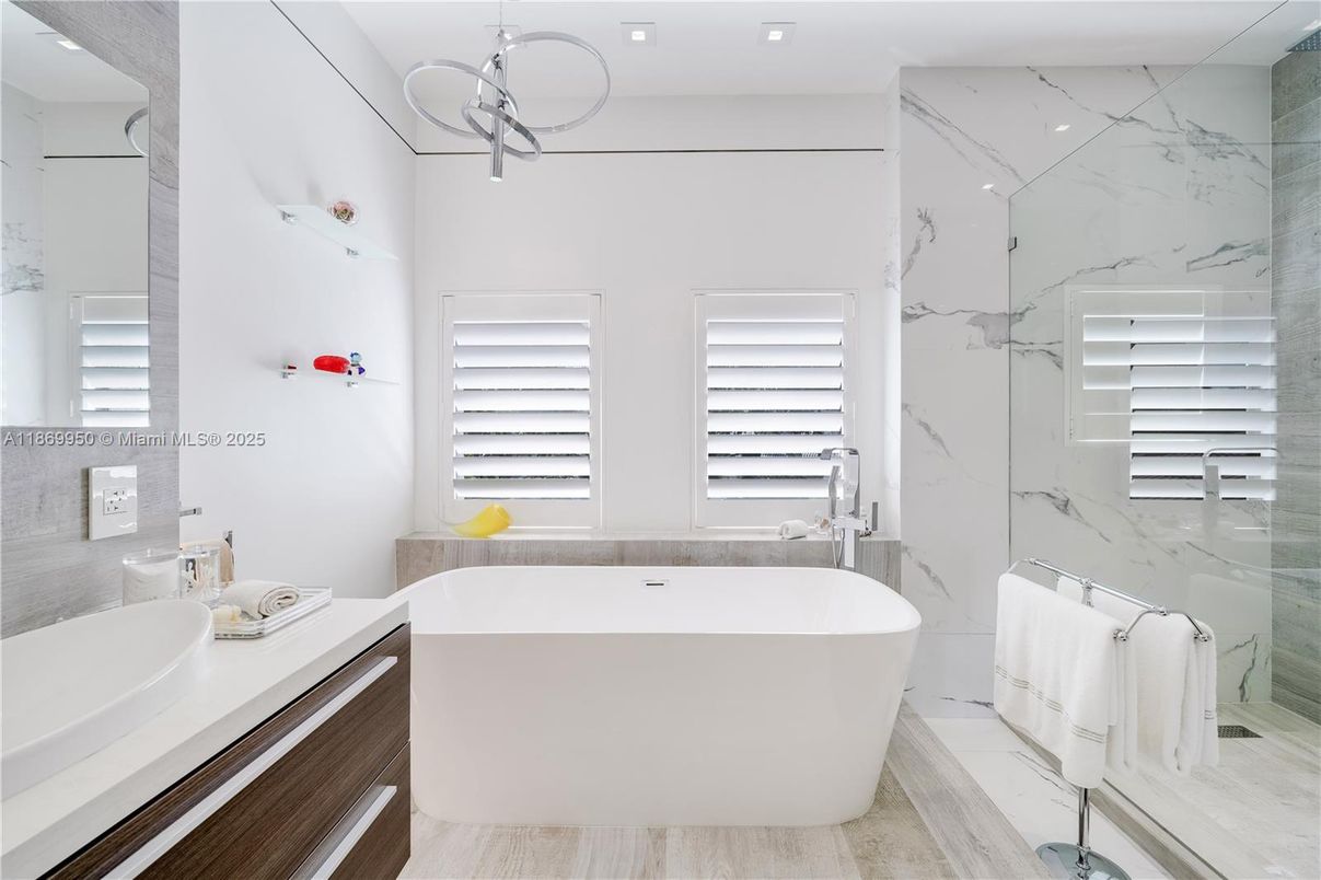 Bathroom, Free Standing Baths, Interior, Marble Walls, Recessed Lighting, Wood Texture Flooring