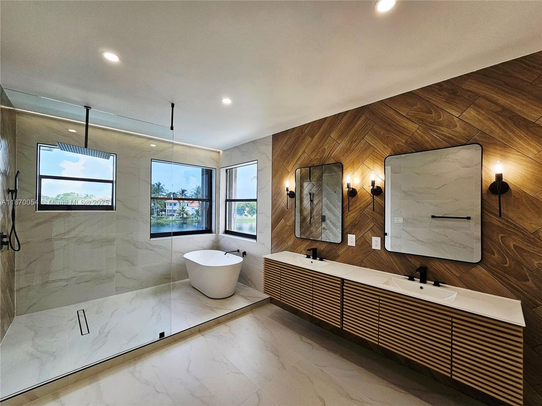 Bathroom, Dual Sink Vanities, Free Standing Baths, Interior, Marble, Marble Walls, Recessed Lighting, Wooden Walls
