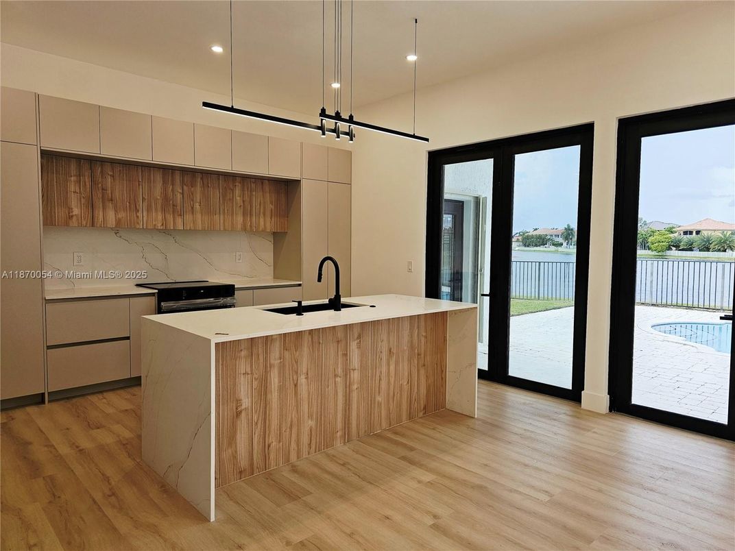 Interior, Kitchen, Marble Walls, Pendant Lights, Recessed Lighting, Water, Wood Texture Flooring
