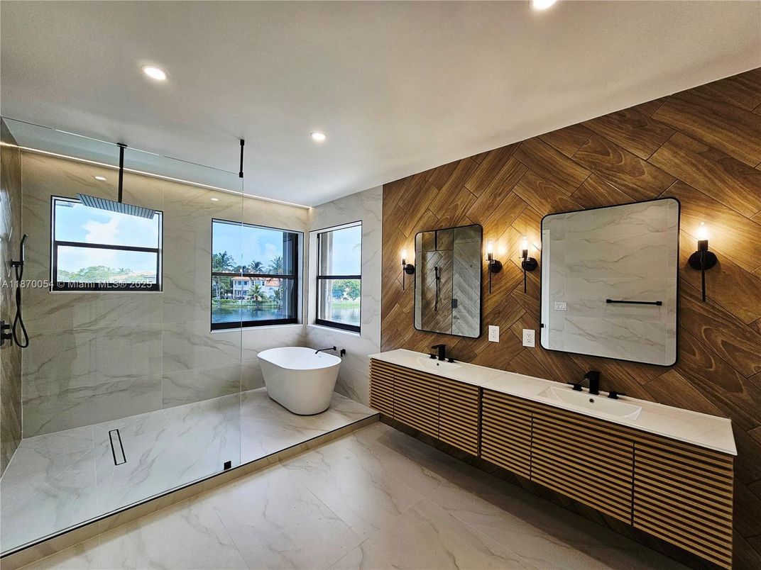 Bathroom, Dual Sink Vanities, Free Standing Baths, Interior, Marble, Marble Walls, Recessed Lighting, Wooden Walls