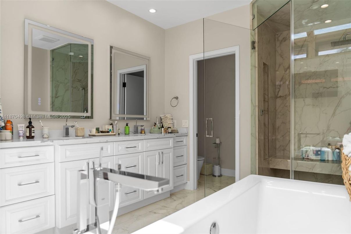 Bathroom, Dual Sink Vanities, Glass Shower, Interior, Marble, Marble Walls, Recessed Lighting