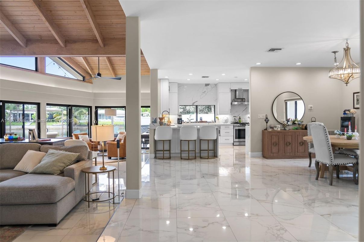 Dining room, Interior, Kitchen, Living room, Marble, Marble Walls, Pendant Lights, Recessed Lighting, Stainless Steel Appliances, Wooden Beams, Wooden Ceilings