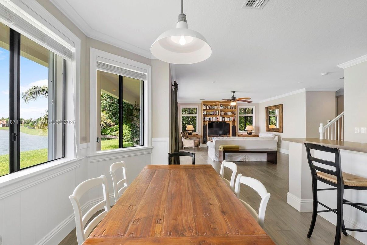 Dining room, Fireplace, Interior, Living room, Pendant Lights, Water, Wood Texture Flooring