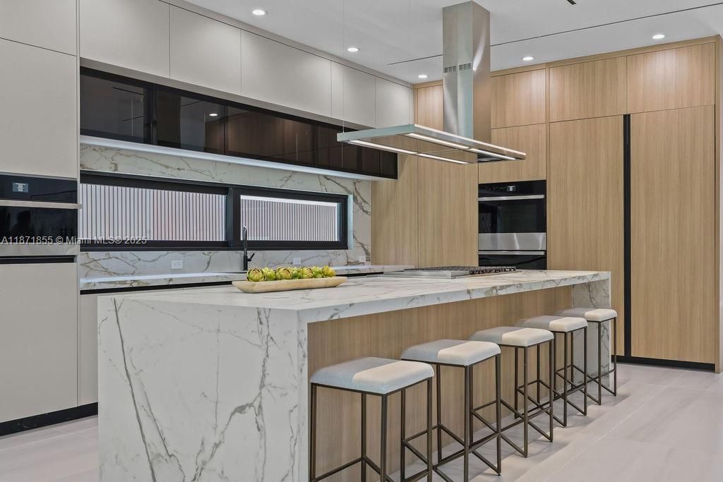 Interior, Kitchen, Marble Walls, Recessed Lighting, Stainless Steel Appliances