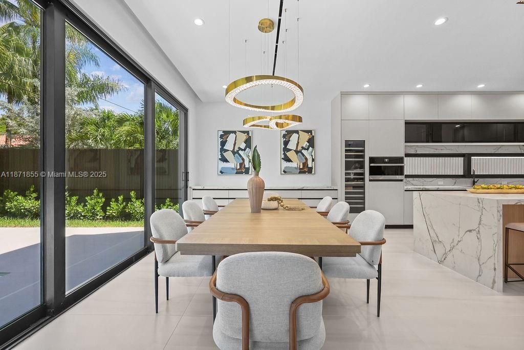 Dining room, Interior, Kitchen, Marble Walls, Pendant Lights, Recessed Lighting, Stainless Steel Appliances
