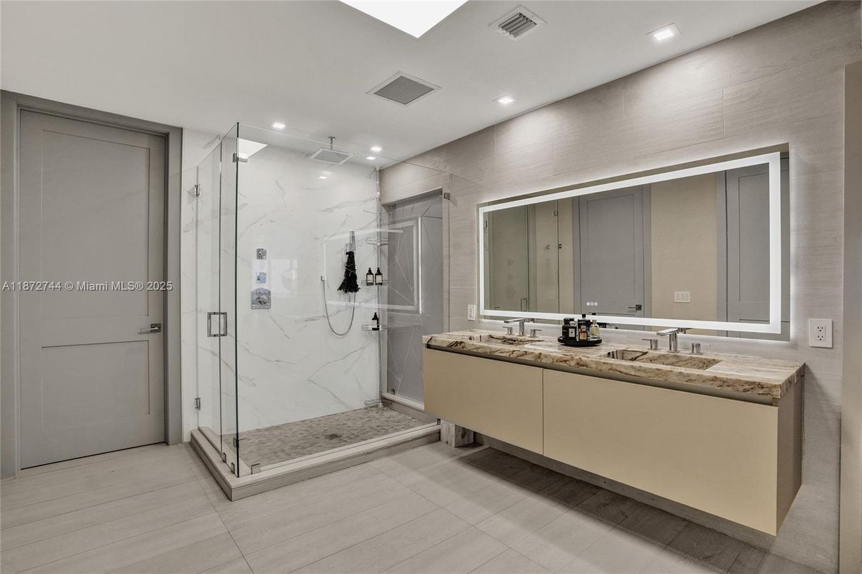 Bathroom, Dual Sink Vanities, Glass Shower, Interior, Marble Walls, Recessed Lighting