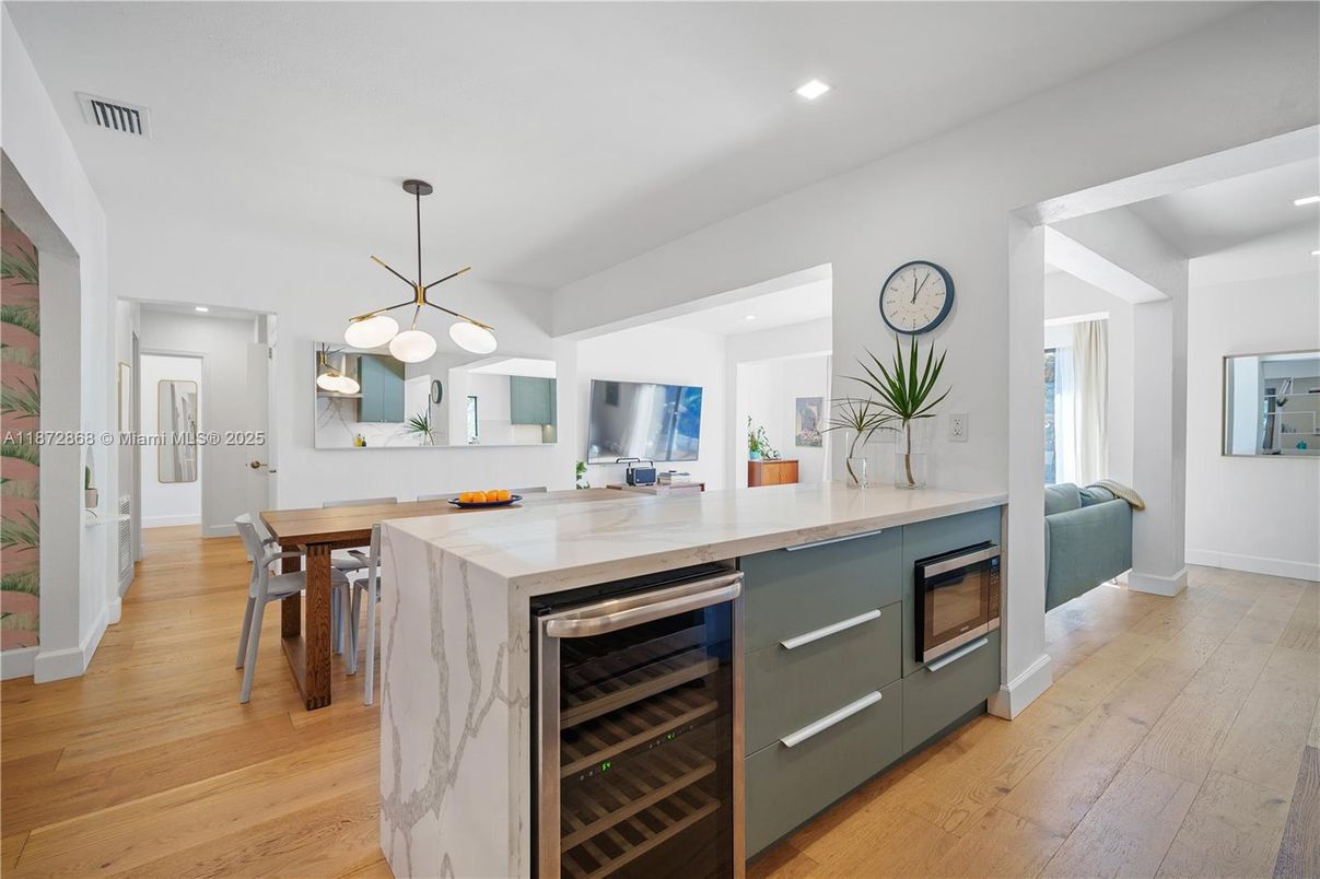 Dining room, Interior, Kitchen, Pendant Lights, Recessed Lighting, Stainless Steel Appliances, Wood Texture Flooring