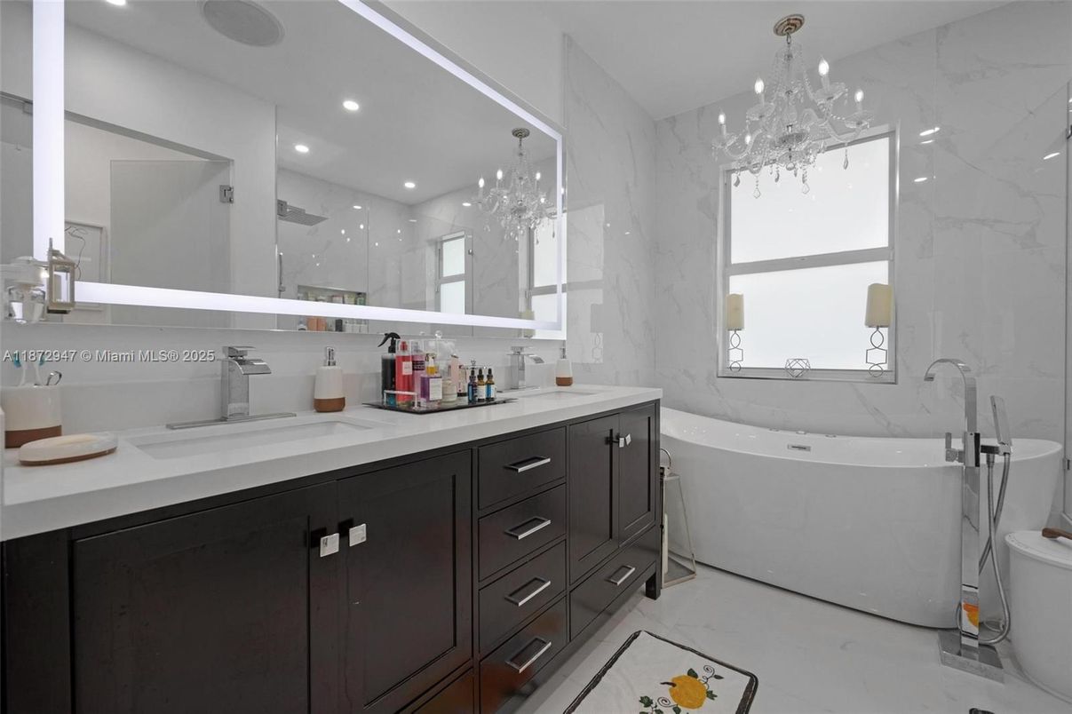 Bathroom, Chandelier, Dual Sink Vanities, Free Standing Baths, Interior, Marble, Marble Walls, Recessed Lighting
