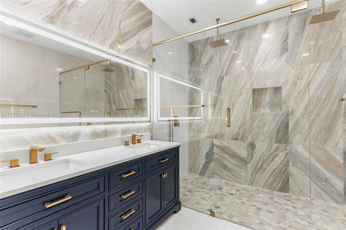 Bathroom, Dual Sink Vanities, Glass Shower, Interior, Marble Walls, Recessed Lighting