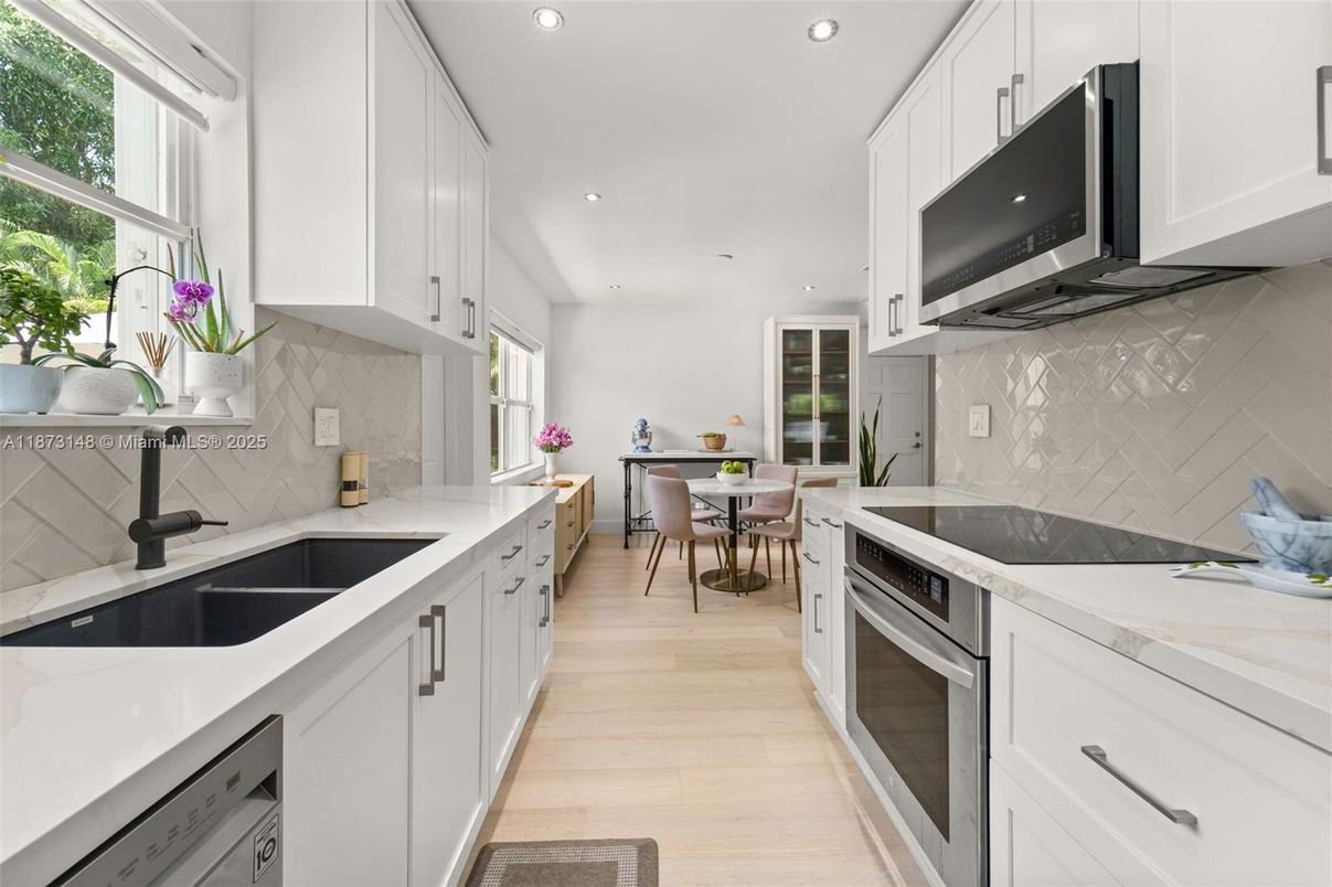 Dining room, Interior, Kitchen, Recessed Lighting, Stainless Steel Appliances, Wood Texture Flooring