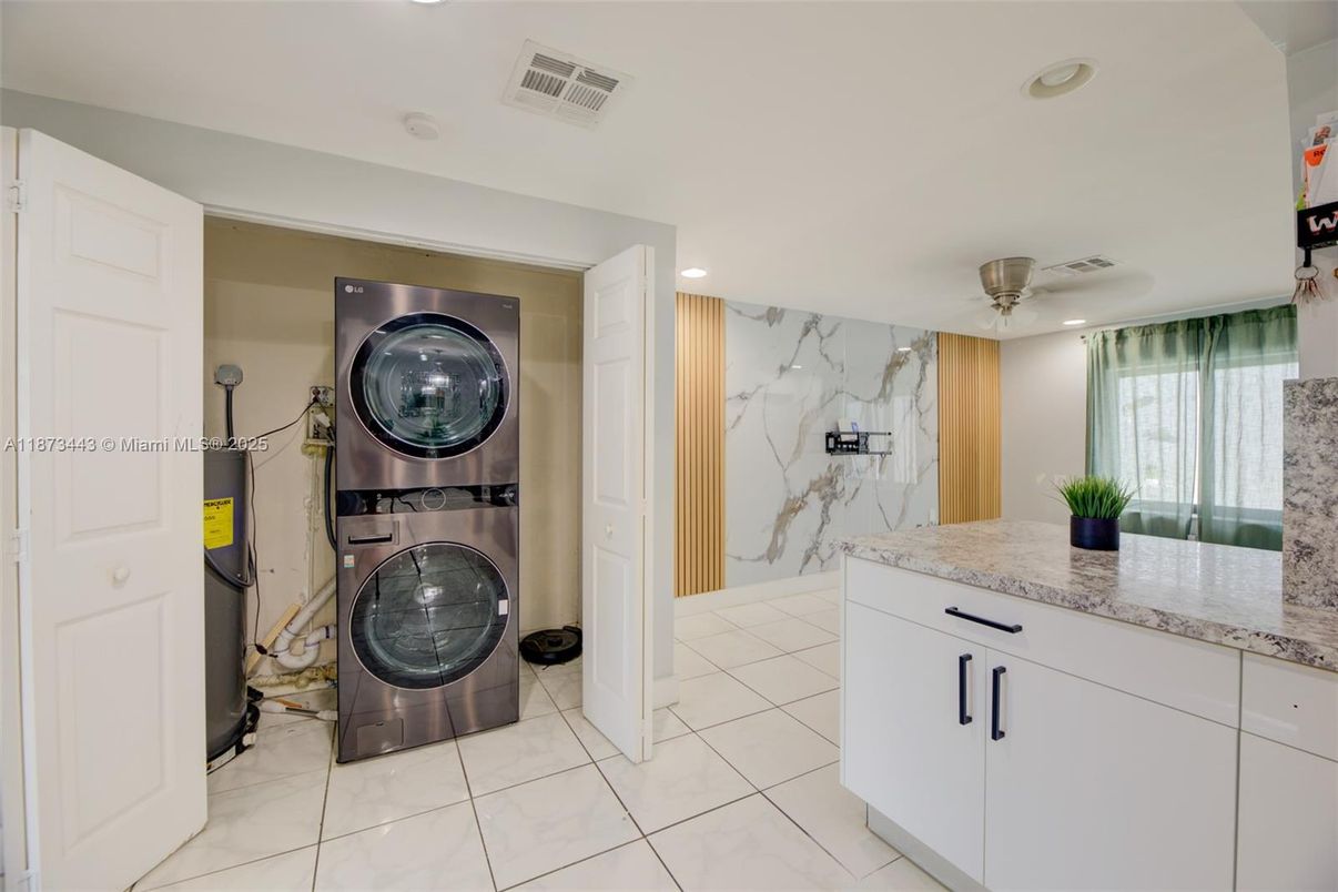 Interior, Kitchen, Marble Walls, Recessed Lighting, Utility Closets, Washer