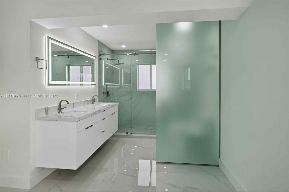 Bathroom, Dual Sink Vanities, Glass Shower, Interior, Marble, Marble Walls, Recessed Lighting