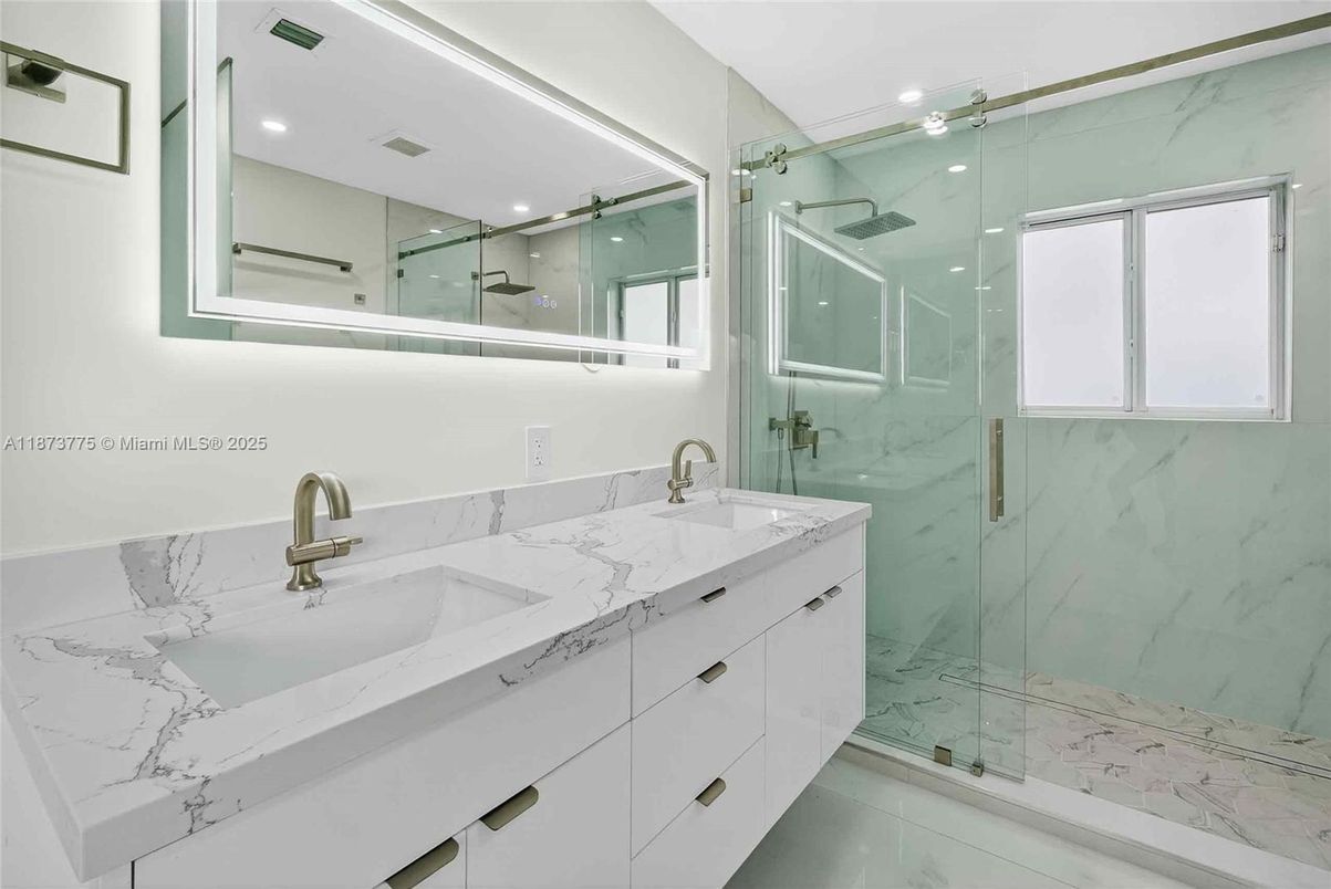 Bathroom, Dual Sink Vanities, Glass Shower, Interior, Marble, Marble Walls, Recessed Lighting