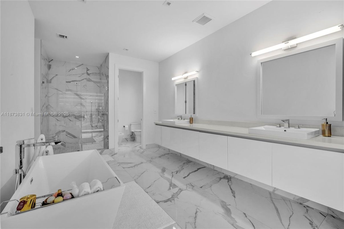 Bathroom, Dual Sink Vanities, Glass Shower, Interior, Marble, Marble Walls, Recessed Lighting