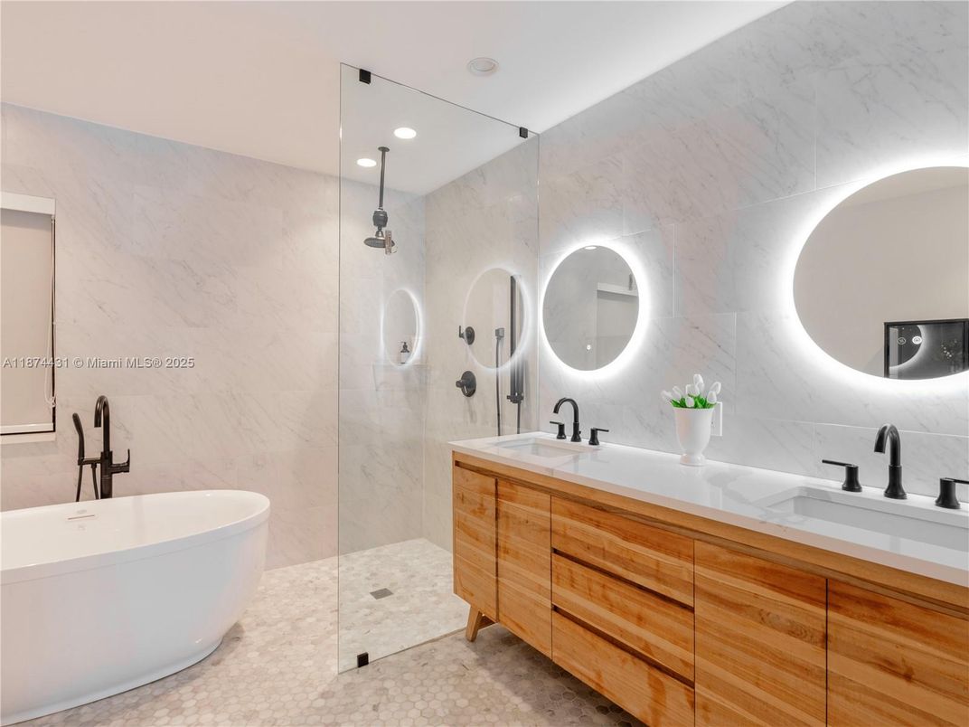 Bathroom, Dual Sink Vanities, Free Standing Baths, Glass Shower, Interior, Marble Walls, Recessed Lighting